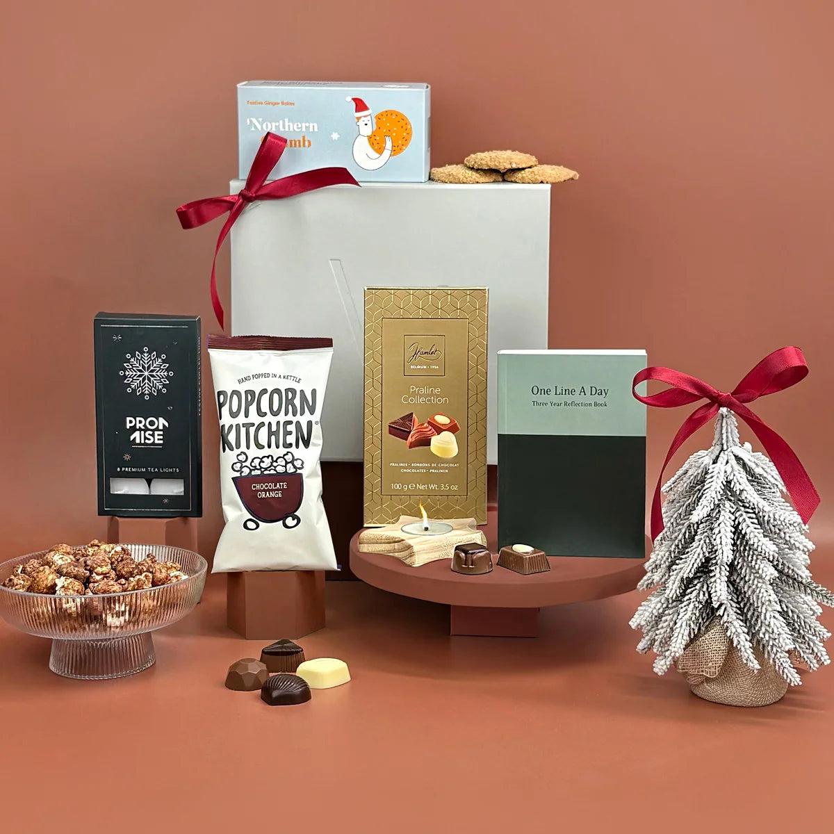 Assorted snacks and treats on a brown background with decorative elements.