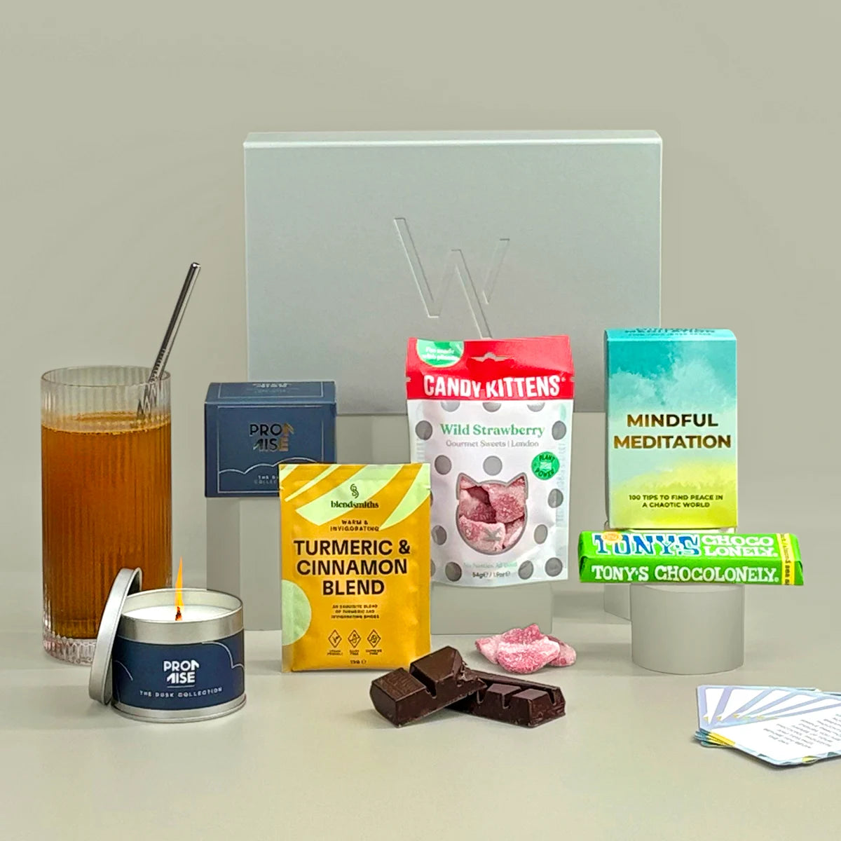 2025 Diwali Gift including, exclusive candle, sweet treats, self-care meditation cards and warming drink.