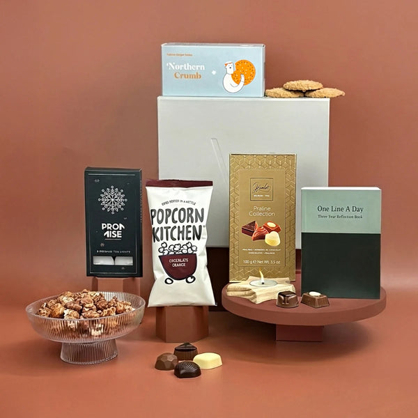 Self-care gift with sweet treats, exclusive wellness items and a charitable donation.