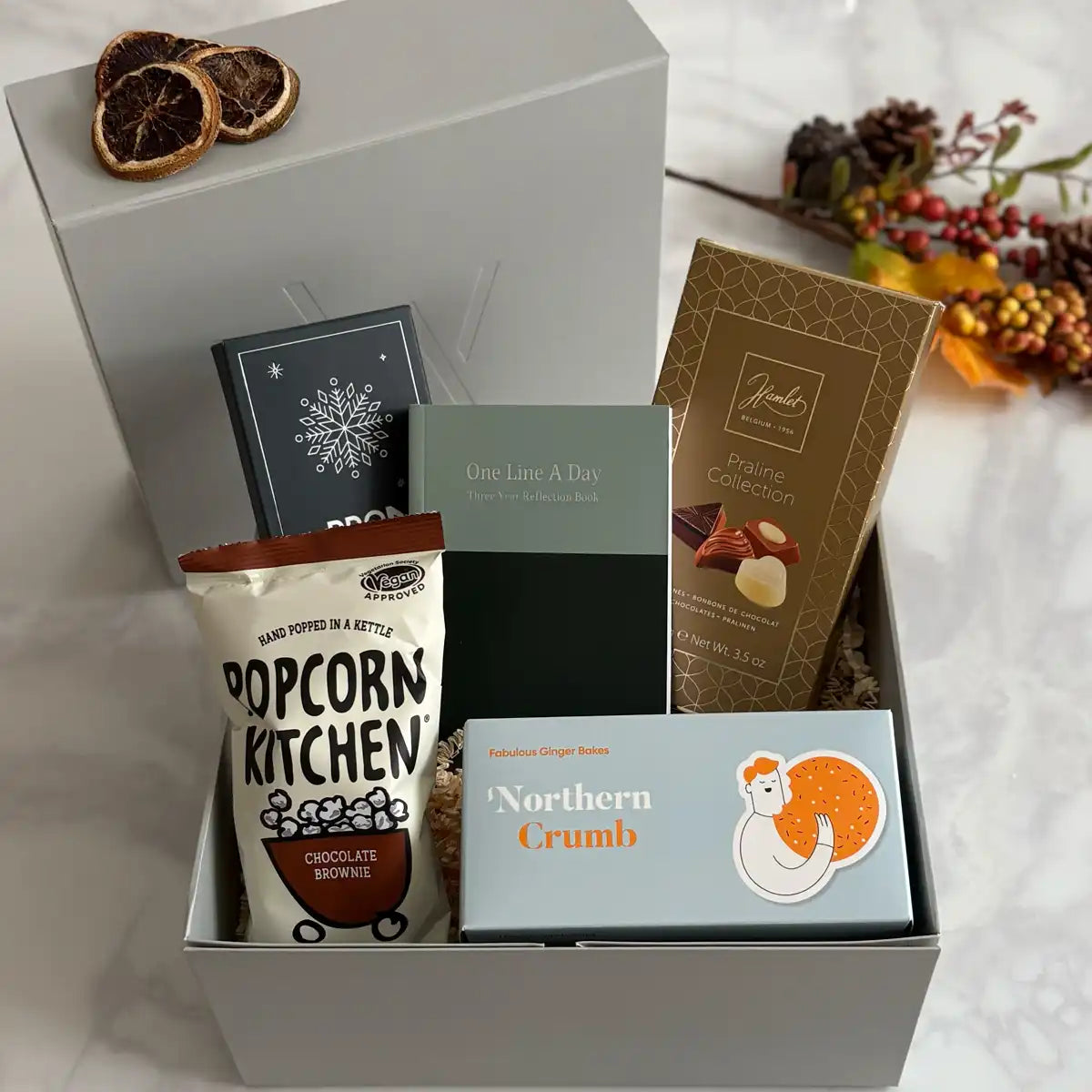 Glisten Festive self care gift in a premium reusable gift box.