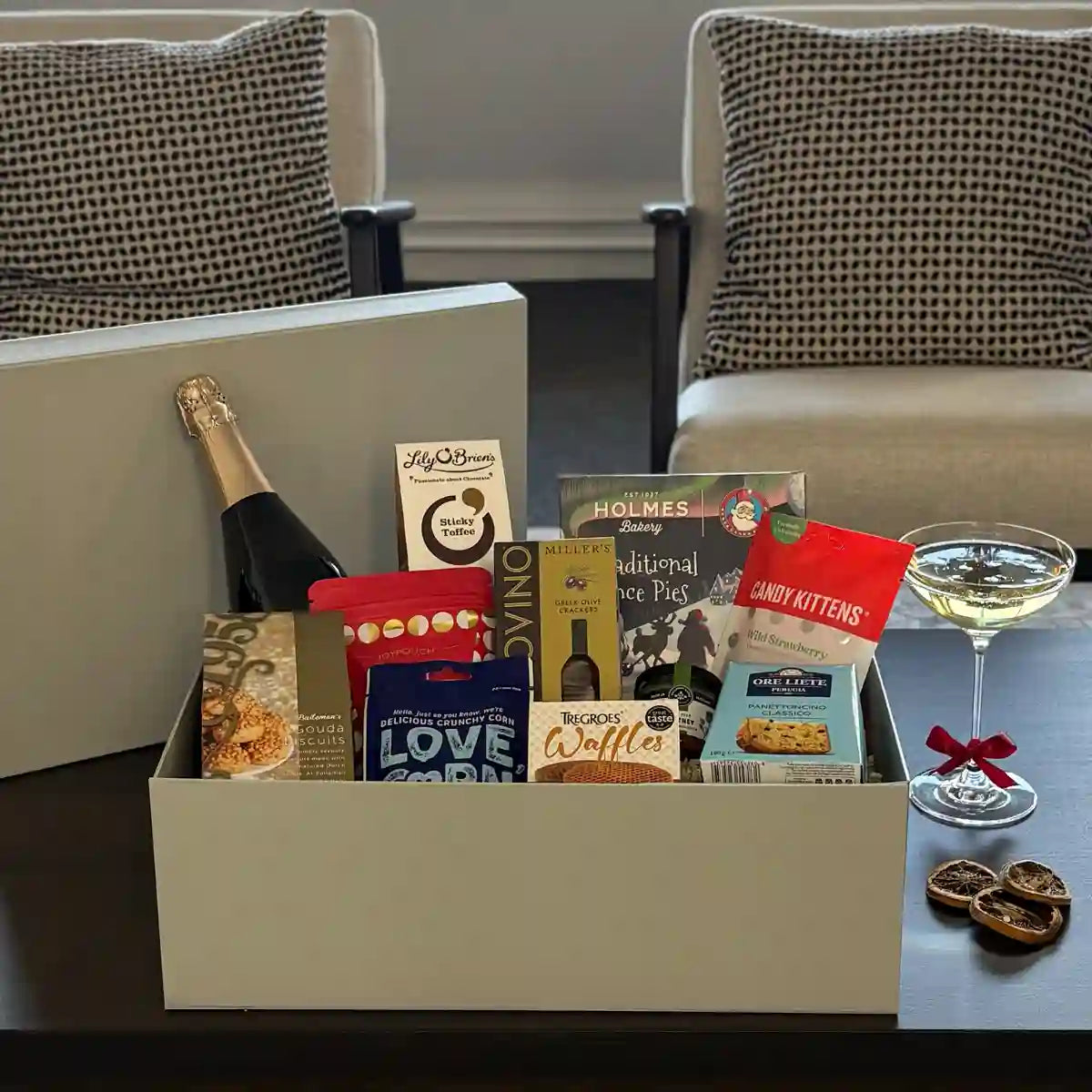 Holly Christmas Gift Hamper with seasonal treats and Prosecco.