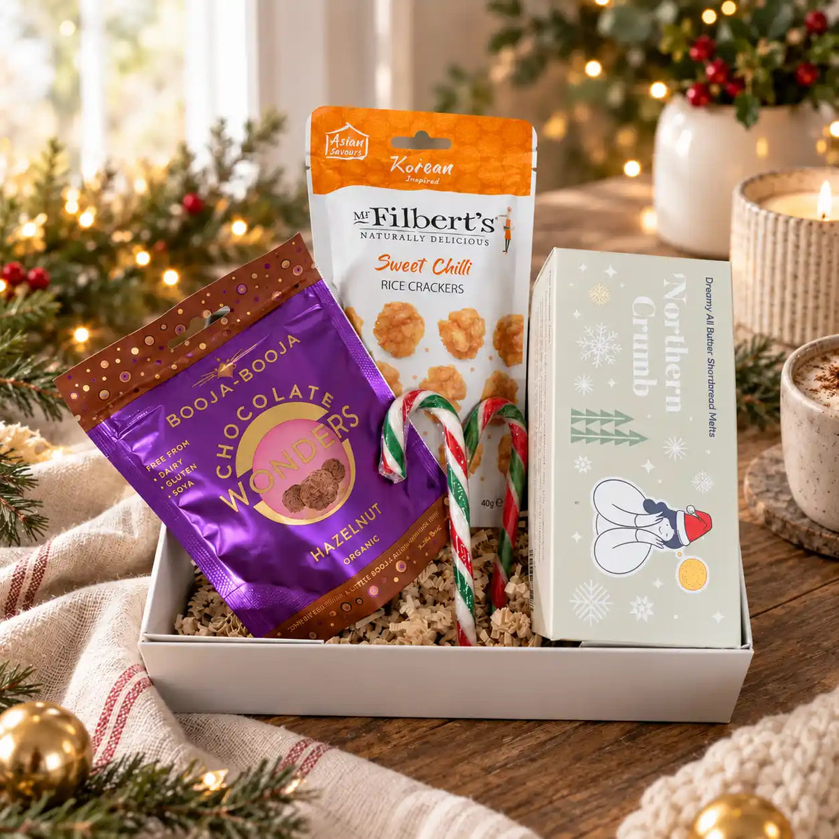 Star festive gift in box with sweet and savoury snacks and a charitable meal donation.